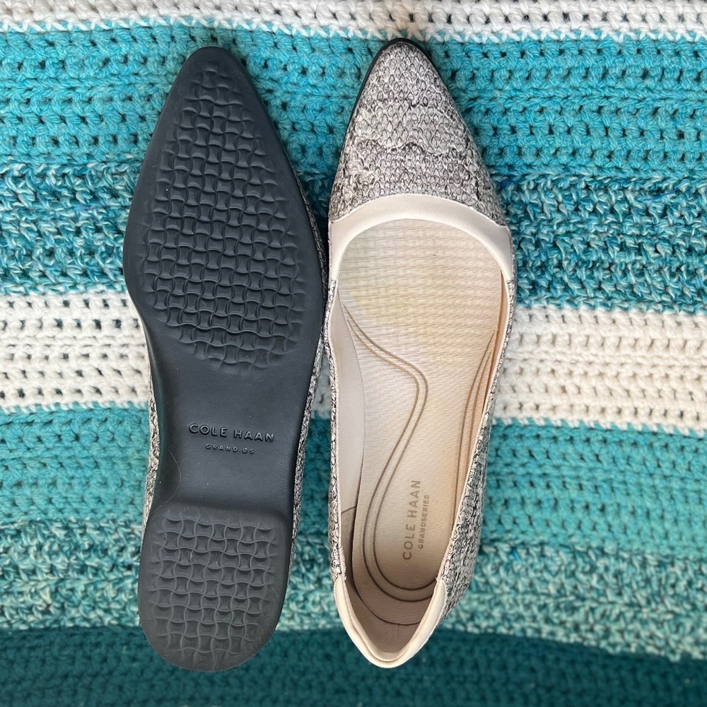 Cole Haan Flats, snake print uppers with cream trim and black sole.